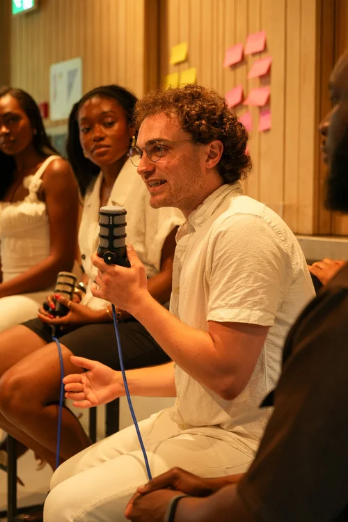 Seven in conversation at an event