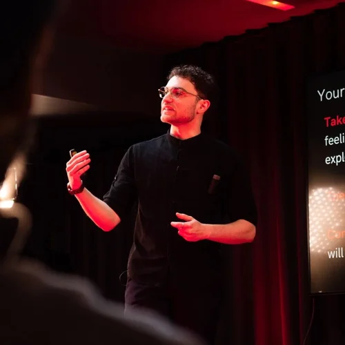 Seven Jacobs speaking on stage